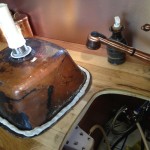 Puttying my copper sink